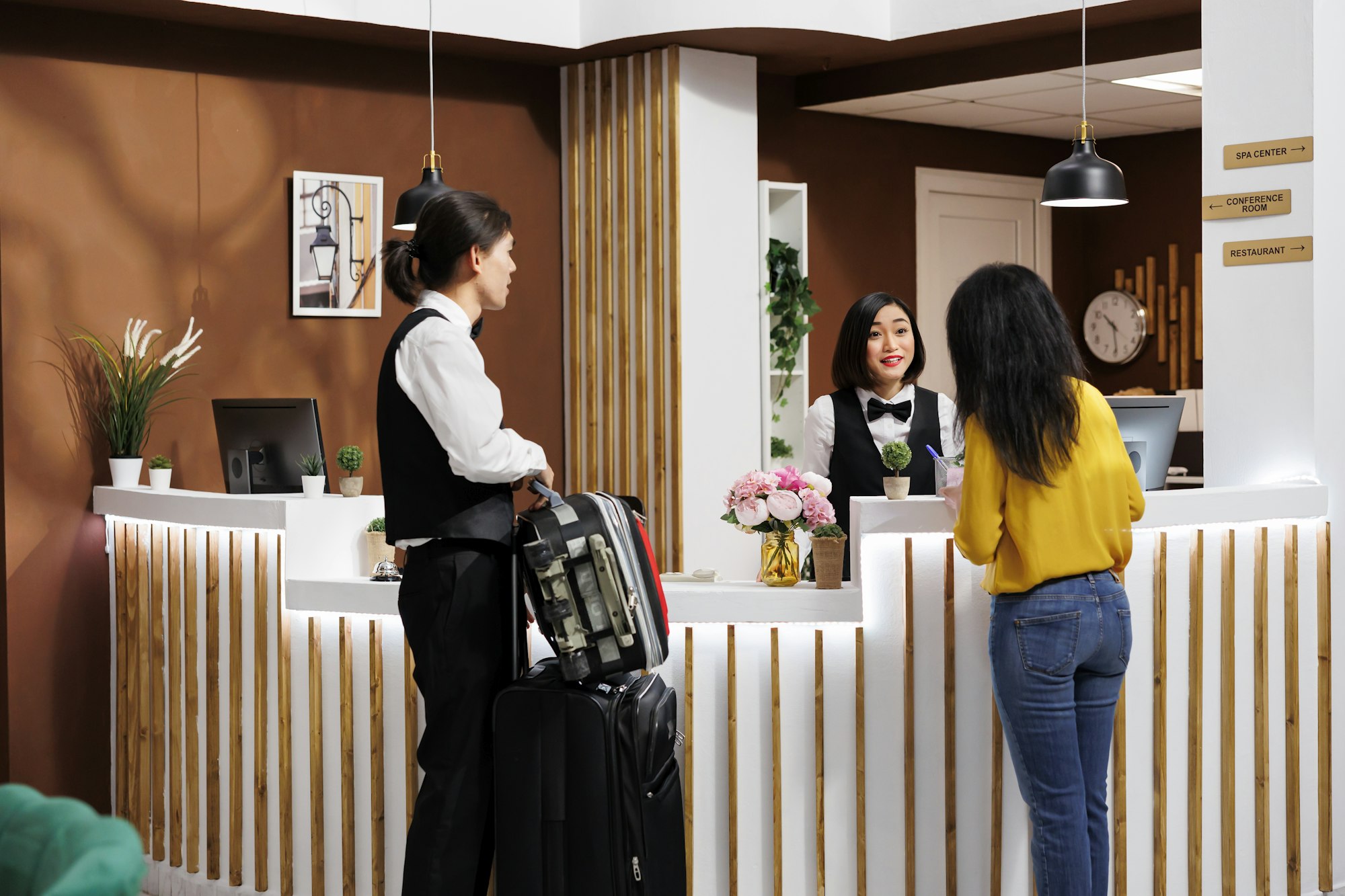 Hotel staff helps client settle in